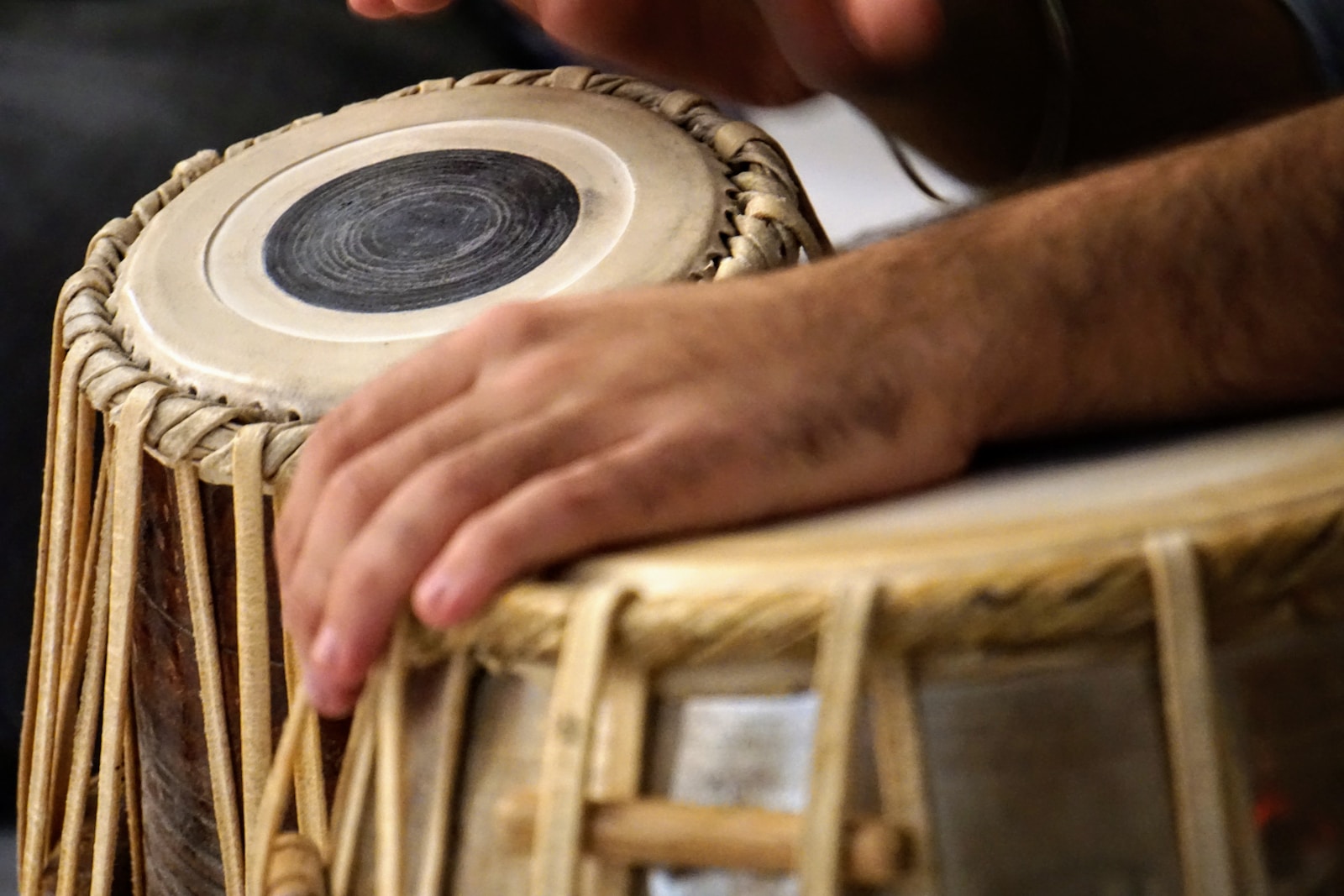 a close up of a person playing a musical instrument